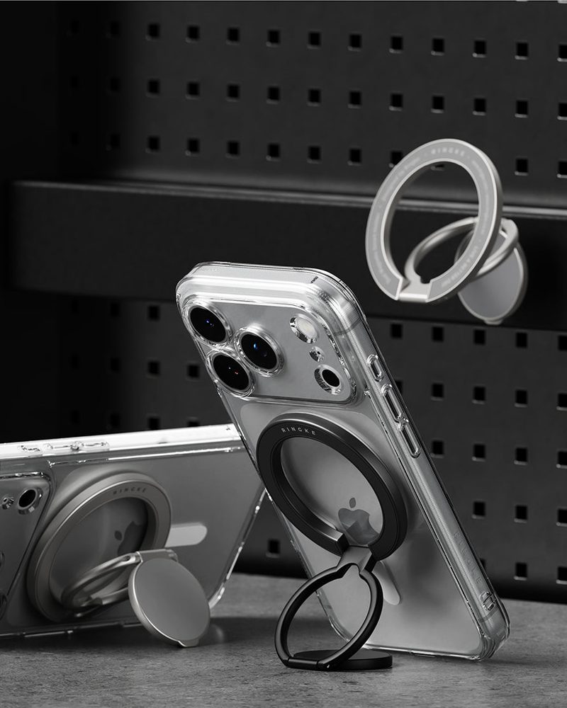The holder on a phone standing on a dark surface.